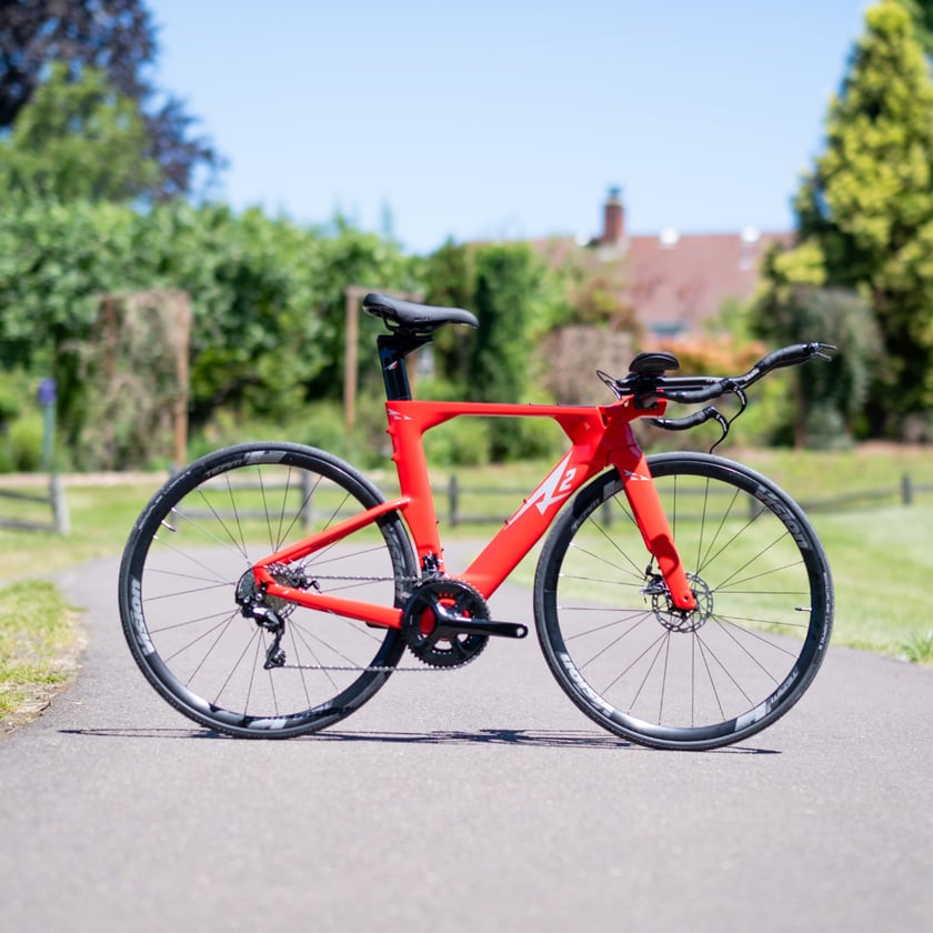 A red triathlon time trial bike