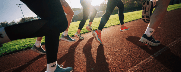 Runners on running track at track level